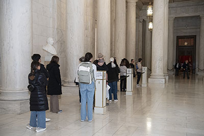 Visitors lined up in the Great Hall awaiting the start of a Courtroom Lecture.