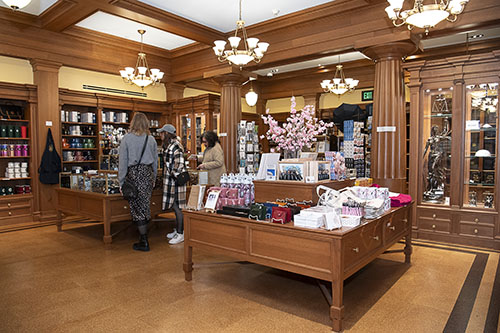 Visitors browse gift shop items and displays.