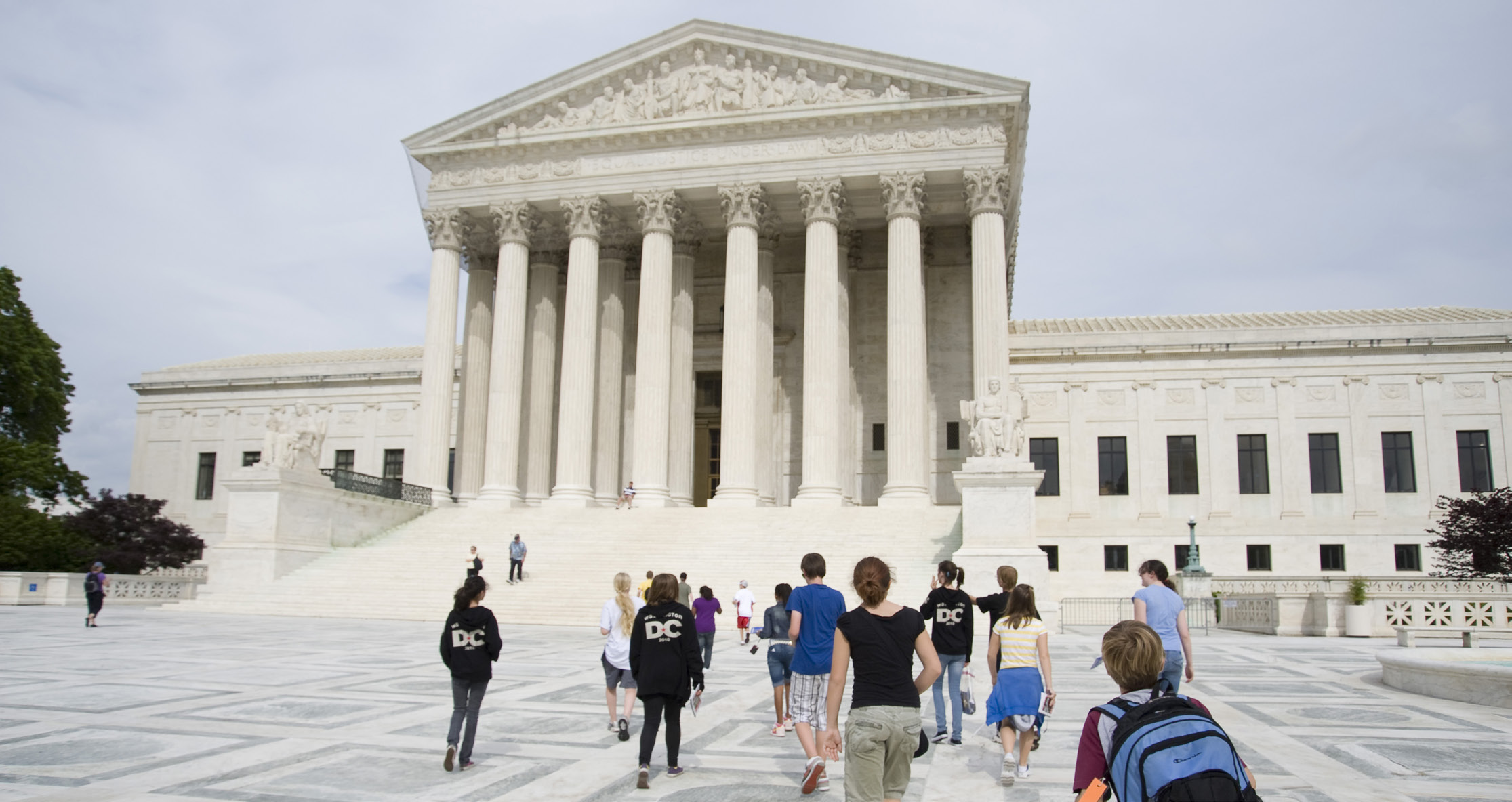 Students walk on the plaza in front of the Supreme Court Building.