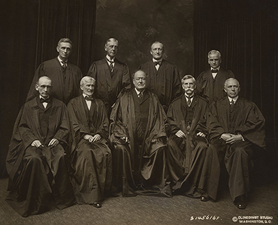 The White Court, as it was comprised from October 9, 1916 until May 19, 1921. Seated from left are Justices William R. Day and Joseph McKenna, Chief Justice Edward Douglas White, and Justices Oliver Wendell Holmes, Jr., and Willis Van Devanter. Standing from left are Justices Louis D. Brandeis, Mahlon Pitney, James C. McReynolds and John H. Clarke.
