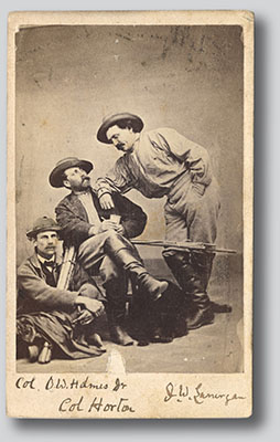 Oliver Wendell Holmes, seated on the floor, plays the straight man beside Horton, who looks up with mock concern at Lanergan, who leans over him melodramatically. The names below are written in Holmes’ hand. Another photograph of the three is in the collection of Harvard Law School.
