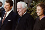 Justice Sandra Day O'Connor with Chief Justice Warren E. Burger and President Ronald Reagan on the day of Justice O'Connor's Investiture, September 25, 1981