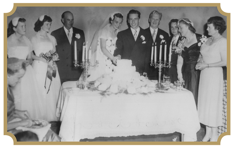The O’Connors’ participate in a cake-cutting ceremony at their wedding reception.
