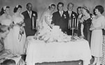 The O’Connors’ participate in a cake-cutting ceremony at their wedding reception, December 20, 1952
