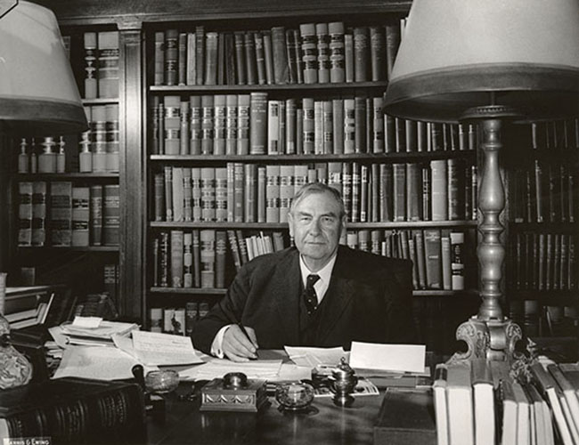 Chief Justice Harlan Fiske Stone at his desk in his home office, October 4, 1941.