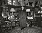 Stone standing in his home office