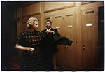 Messenger Tim Moore assists Justice Sandra Day O'Connor with her robe in the Justices’ Robing Room, c. 1986